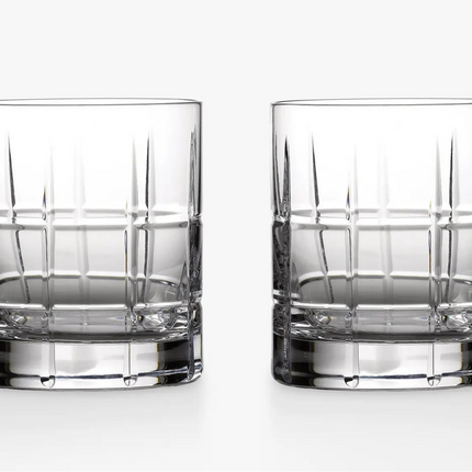 Two clear cut-crystal whiskey glasses with a grid pattern, shown side-by-side on a clean white background.