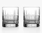Two clear cut-crystal whiskey glasses with a grid pattern, shown side-by-side on a clean white background.