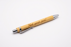 wooden pens engraved with the phrase 'Not your pen!' in black script, arranged diagonally on a plain white surface.