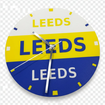 A circular vintage-style Leeds gas station wall clock with a white, yellow, and blue color scheme and silver hands, photographed on a neutral light gray background.
