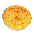 A round wooden coasters featuring a laser-engraved design of an hourglass, a soccer ball, and the text 'CHAMPIONS OF EUROPE' and 'WE ARE THE CHAMPIONS' on a dark textured background.