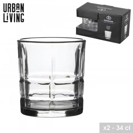 A clear cut-glass tumbler with a thick base and vertical fluted pattern, shown alongside its black Urban Living branded packaging box on a white background.