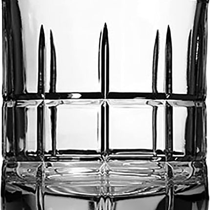 Clear glass tumbler with geometric design on a black background