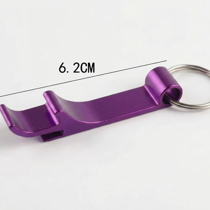 A purple anodized aluminum bottle opener keychain with a silver metal key ring, shown on a white background with dimension lines indicating a length of 6.2CM and a height of 1.