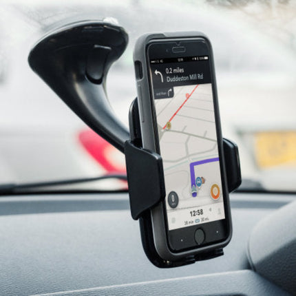 A black car windshield suction mount holding a smartphone with a navigation app displayed on the screen, installed on a car dashboard.