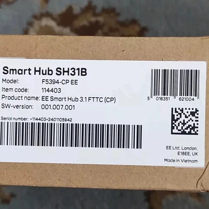 A close-up of a brown cardboard box with a white printed label reading 'Smart Hub SH31B' and product details, barcode, and QR code.